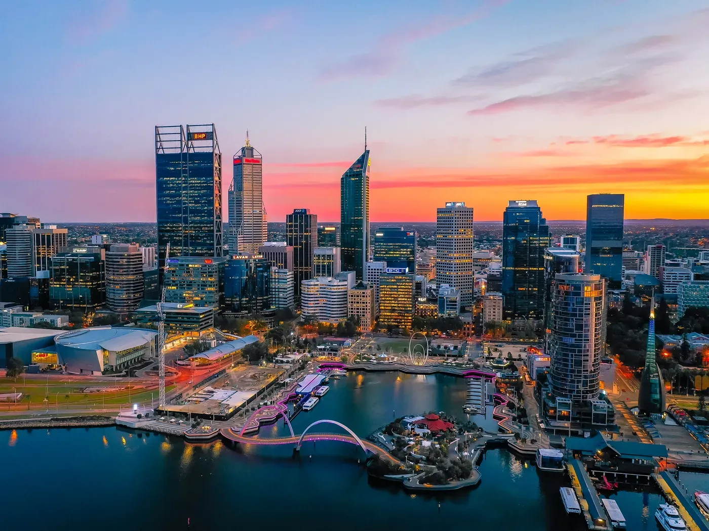Perth city skyline at sunset over Elizabeth Quay and the Swan River